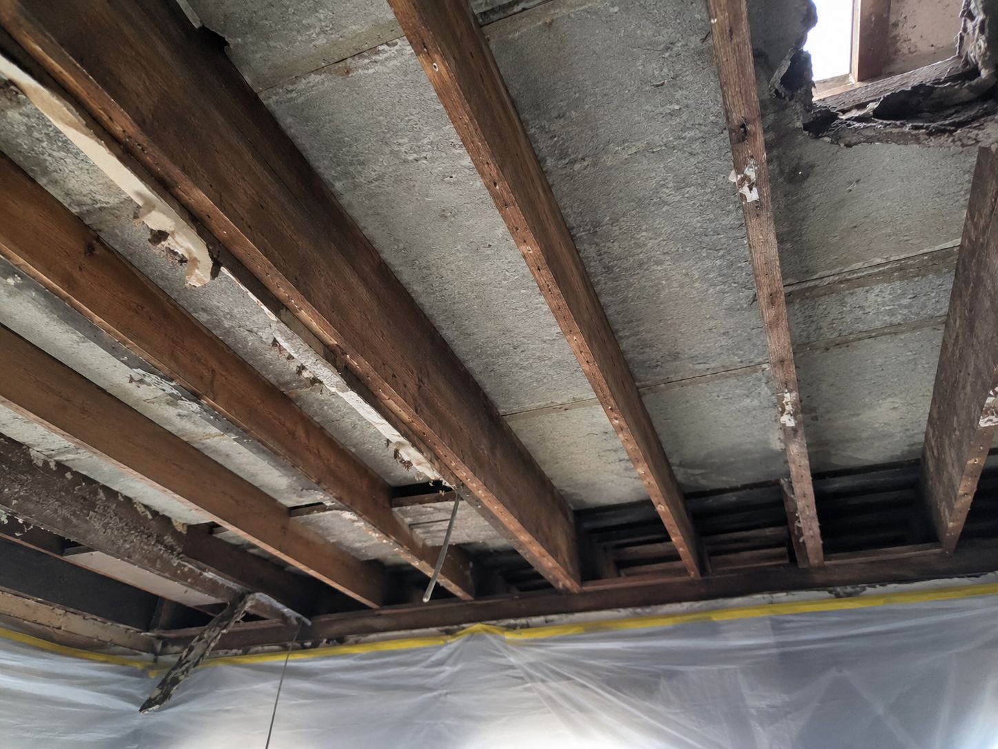 Professional asbestos removal team working in full protective equipment